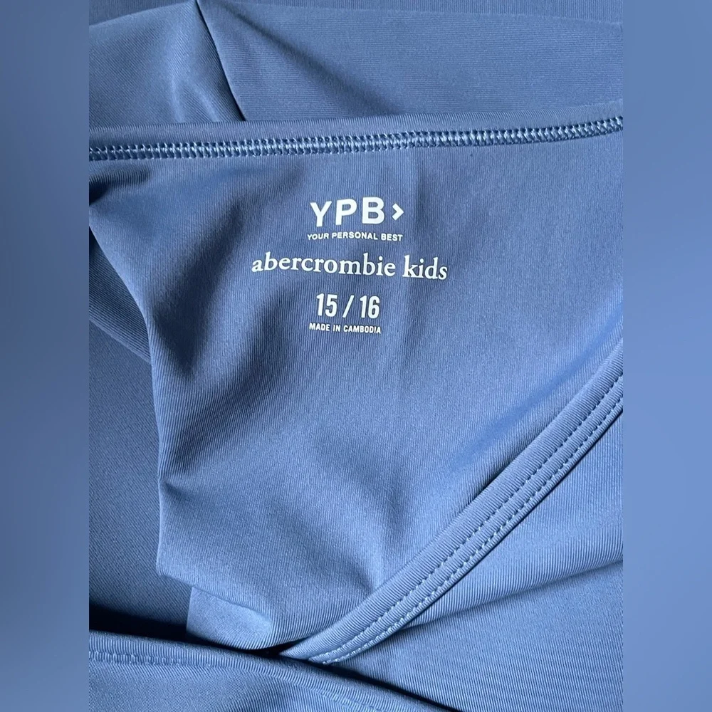 Abercrombie Kids youth YPB activewear romper in blue.